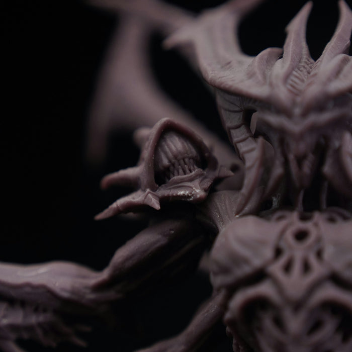 Close-up of a highly detailed 3D-printed resin fantasy miniature showing fine heroic-scale surface detail