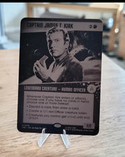 Custom laser engraved metal trading card on a clear display stand